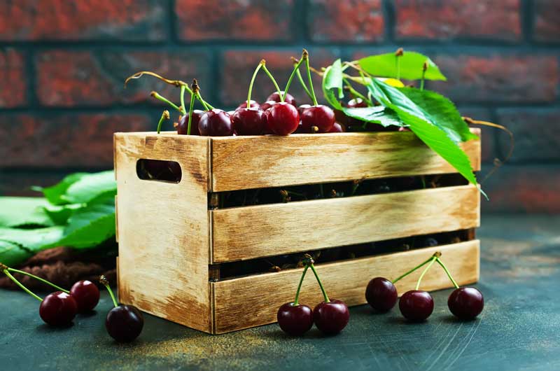 wood crate with cherries
