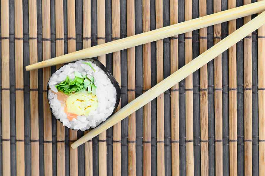 wooden chopsticks with sushi
